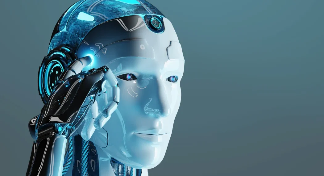 A futuristic humanoid robot with a sleek white and metallic blue design holds its hand to the side of its head. The 5StarsStocks AI robot features illuminated blue accents and a transparent dome revealing electronic components. The background is a gradient of blue shades. | 5StarsStocks