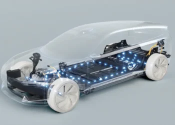 Transparent, futuristic 3D-rendering of an electric car showcasing internal components with illuminated blue lights highlighting the EV battery stocks and electronic systems. The vehicle body is see-through with emphasis on the technology inside, including the drivetrain and battery pack. | 5StarsStocks
