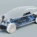 Transparent, futuristic 3D-rendering of an electric car showcasing internal components with illuminated blue lights highlighting the EV battery stocks and electronic systems. The vehicle body is see-through with emphasis on the technology inside, including the drivetrain and battery pack. | 5StarsStocks