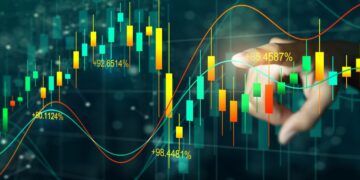 A hand touches a digital screen displaying a colorful financial graph with fluctuating candlestick patterns and percentage data, representing market trends and analysis of high dividend stocks. The background is dark with a network of data points and lines. | 5StarsStocks
