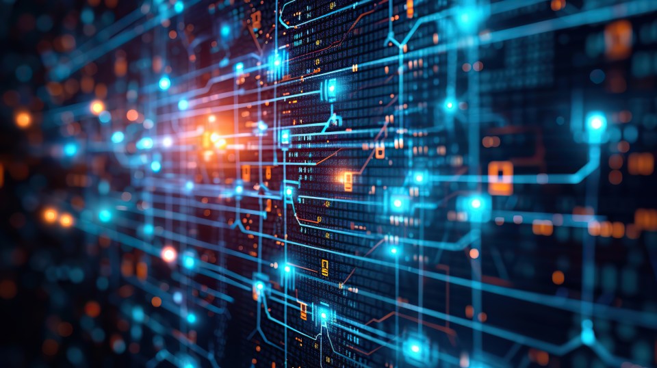 A futuristic digital circuit board with glowing blue and orange lines and nodes, symbolizing data flow and connectivity. The intricate pattern represents advanced technology and a complex network system. The background is dark, highlighting the vibrant lights. | 5StarsStocks Stocks to Invest