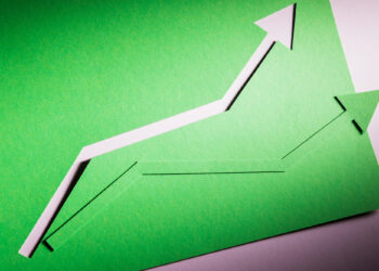 Two green paper arrows pointing upward symbolize growth or progress, set against a green background with shadows emphasizing the cut-out shapes. | 5StarsStocks